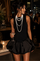 Jessica Bara Shebal Flare Bubble Mini Dress with Pearl Necklace